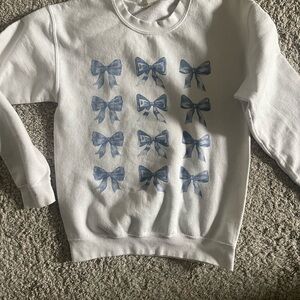 Altar'd State White Sweatshirt with Blue Bow Pattern